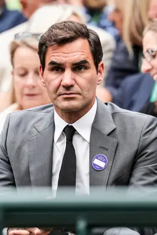 Image may contain Roger Federer Accessories Formal Wear Tie Face Head Person Photography Portrait and Clothing