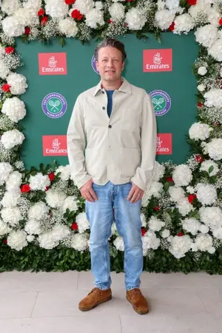 Image may contain Jamie Oliver Person Standing Clothing Pants Adult Jeans Footwear and Shoe