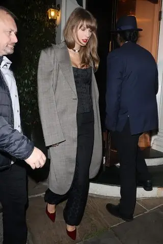 Taylor Swift in London wearing Vivienne Westwood and Gucci