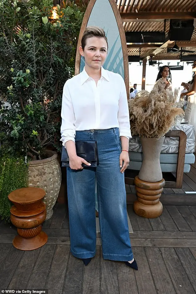 Ginnifer Goodwin, 46, cut an effortlessly cool figure in a white button-up shirt paired with wide-leg jeans