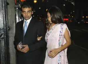 LONDON, UNITED KINGDOM: Amit Bhatia (L) and Vanisha Mittal (R), daughter of Multimillionaire Steel businessman Laxmi Mittal arrive at Annabels nightclub in London, 05 June 2004 for their engagement party. Vanisha, the 23-year-old daughter of the tycoon, the fifth richest man in Britain, is marrying Amit Bhatia, 25, a London-based financer on June 22 in Paris. AFP PHOTO/CARL DE SOUZA (Photo credit should read CARL DE SOUZA/AFP via Getty Images)