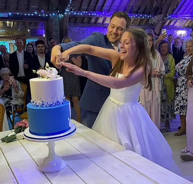 Elizabeth and David Slade are pictured on their wedding day, cutting the cake