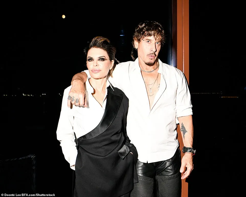 Rinna was also spotted color-coordinating with Steven Klein and the pair paused for a photo after the sun had set