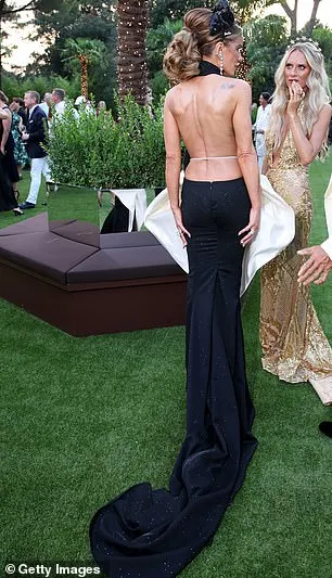 Her garment showcased her stunning figure as it featured a backless design