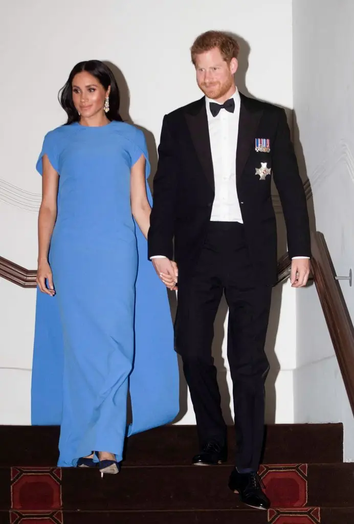 Meghan, Duchess of Sussex in blue cape dress