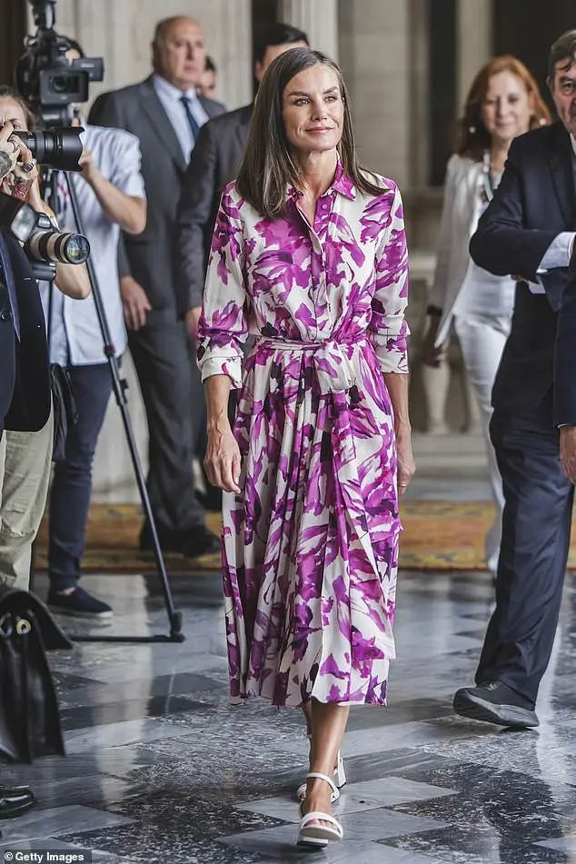 Queen Letizia of Spain looked elegant on Tuesday in a vibrant floral print dress as she chaired the annual meeting of the Cervantes Institute in Barcelona