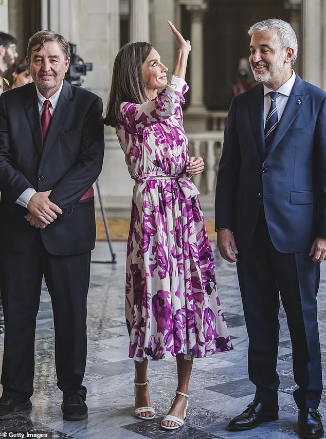 Letizia paired her look with white sandals from BOSS with a chunky heel, which is also one of the Spanish monarch's favourite brands