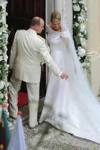 MONACO - JULY 02: (PREMIUM RATES APPLY) Prince Albert II of Monaco and Princess Charlene of Monaco make their journey to Sainte Devote church after their religious wedding ceremony at the Prince's Palace of Monaco on July 2, 2011 in Monaco. The Roman-Catholic ceremony followed the civil wedding which was held in the Throne Room of the Prince's Palace of Monaco on July 1. With her marriage to the head of state of Principality of Monaco, Charlene Wittstock has become Princess consort of Monaco and gained the title, Princess Charlene of Monaco. Celebrations including concerts and firework displays are being held across several days, attended by a guest list of global celebrities and heads of state. (Photo by Francois Durand/PP/Getty Images)