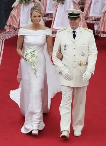 MONACO - JULY 02: Prince Albert II of Monaco and Princess Charlene of Monaco leave their religious wedding ceremony in the main courtyard at the Prince's Palace on July 2, 2011 in Monaco. The Roman-Catholic ceremony follows the civil wedding which was held in the Throne Room of the Prince's Palace of Monaco on July 1. With her marriage to the head of state of the Principality of Monaco, Charlene Wittstock has become Princess consort of Monaco and gains the title, Princess Charlene of Monaco. Celebrations including concerts and firework displays are being held across several days, attended by a guest list of global celebrities and heads of state. (Photo by Andreas Rentz/Getty Images)