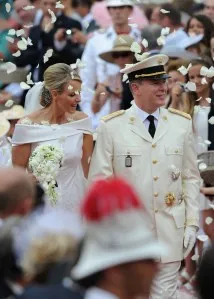 MONACO - JULY 02: Princess Charlene of Monaco and Prince Albert II of Monaco leave the religious ceremony of the Royal Wedding of Prince Albert II of Monaco to Princess Charlene of Monaco at the Prince's Palace on July 2, 2011 in Monaco. The Roman-Catholic ceremony follows the civil wedding which was held in the Throne Room of the Prince's Palace of Monaco on July 1. With her marriage to the head of state of Principality of Monaco, Charlene Wittstock has become Princess consort of Monaco and gain the title, Princess Charlene of Monaco. Celebrations including concerts and firework displays are being held across several days, attended by a guest list of global celebrities and heads of state. (Photo by Venturelli/WireImage)