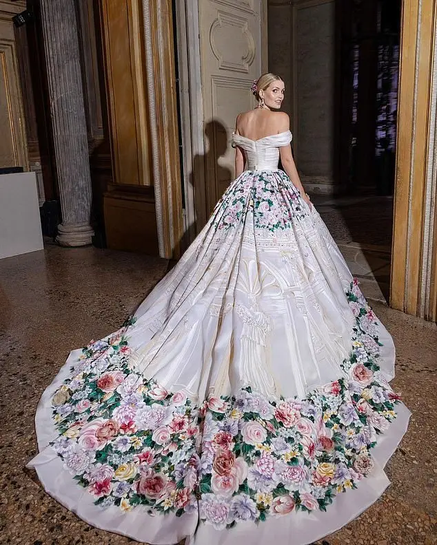 Following the nuptials, the bride changed into a stunning silk ballgown, hand-painted with intricate florals