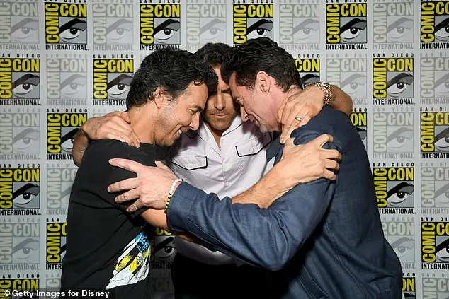 The film's director Shawn Levy, who embraced Ryan and Hugh on the red carpet