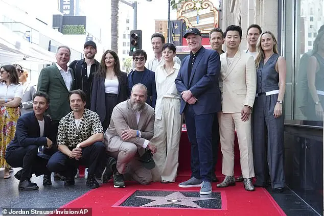 Marvel boss Kevin Feige was supported by a deluge of A-listers at his Hollywood Walk of Fame ceremony on Thursday - L-R - Shawn Levy, Louis D'Esposito, Sebastian Stan, Chris Evans, Kathryn Hahn, David Harbour, Ke Huy Quan, Hugh Jackman, Emma Corrin, Feige, Ryan Reynolds, Simu Liu, Chris Pratt and Brie Larson