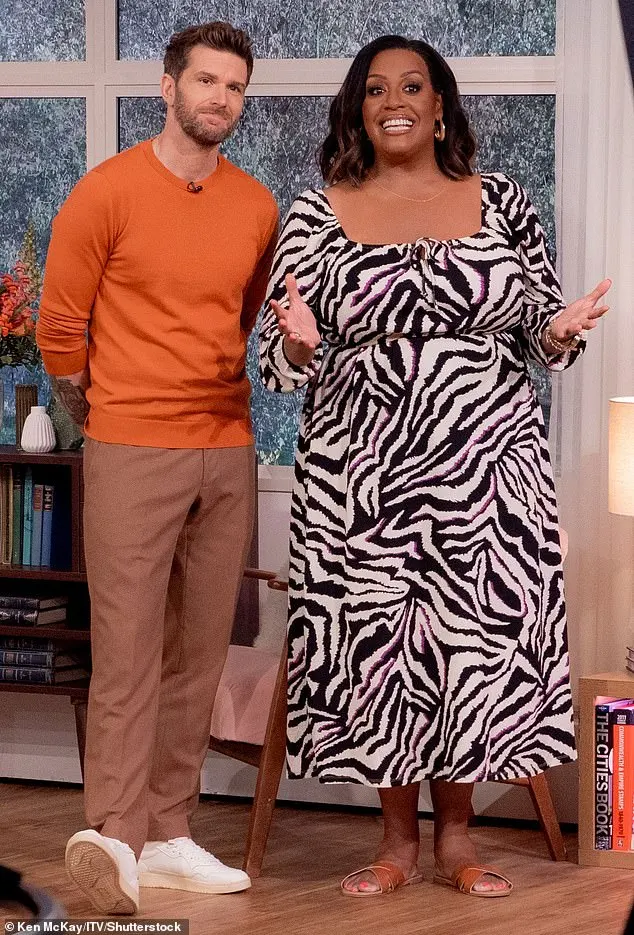 And the star has been loving an animal-print themed look at the moment, as she sported a summery zebra print dress on Tuesday's show (pictured with Joel Dommett)