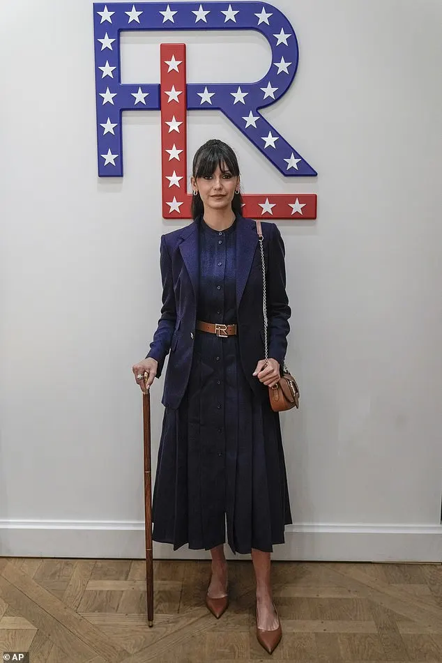 She was joined by Nina Dobrev, 35, who was the epitome of chic in a navy blue pleated button dress and blazer, brown pointed flats and a matching belt and bag