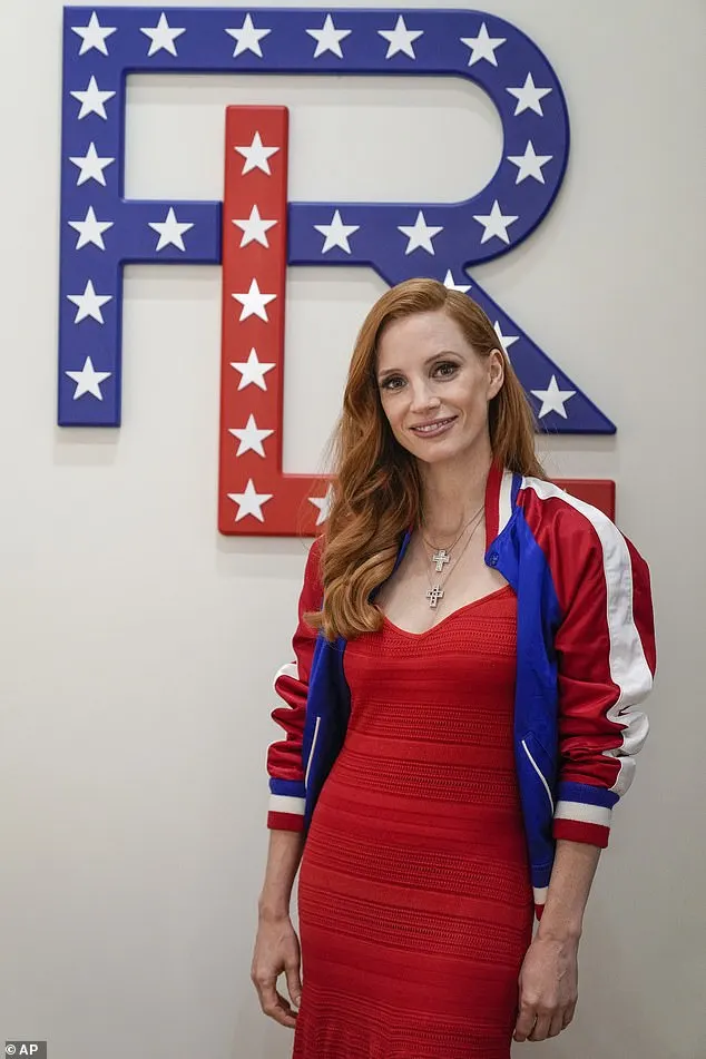 The Academy Award winner sported a Varsity jacket over the top, which boasted the colours of the American flag down the arms and tucked her auburn hair behind one ear