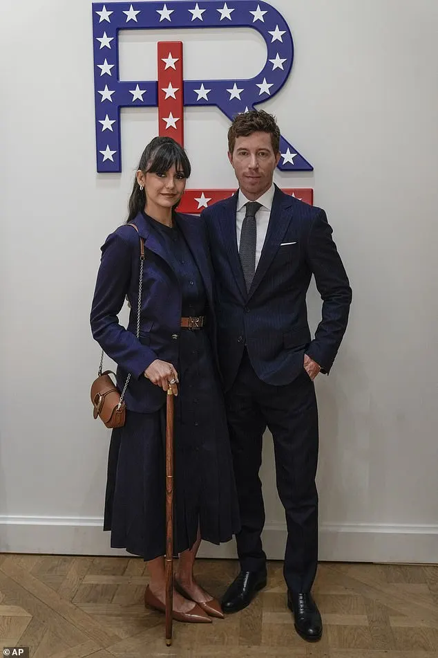 She was joined by her Olympian boyfriend Shaun White, a former professional snowboarder, 37, who matched his injured girlfriend's look with a navy blue suit, crisp white shirt and tie