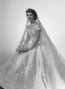 Bridal portrait of Jacqueline Lee Bouvier (1929 - 1994) shows her in an Anne Lowe-designed wedding dress, a bouquet of flowers in her hands, New York, New York, 1953. (Photo by Bachrach/Getty Images)