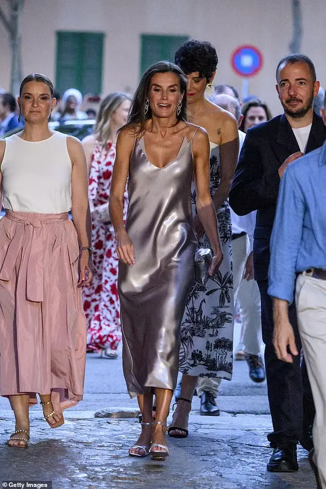 Letizia carried a matching silver clutch to complete her dazzling look as she enjoyed the film festival last night