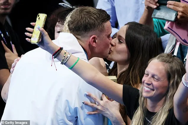 Holly was in the crowd with Adam's son George, three, on Sunday when the Olympic swimmer came second as Italian underdog Nicolo Martinenghi beat him in the 100m Breaststroke final by just 0.02 seconds