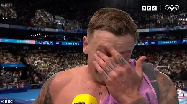 An emotional Adam broke down in tears during a TV interview before making his way to the stands to embrace his loved ones