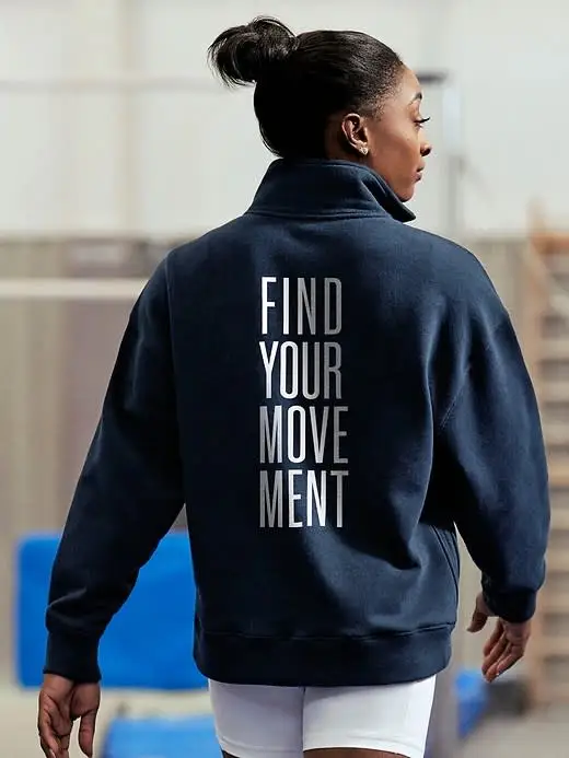 sophie biles wearing navy creative athleta sweatshirt