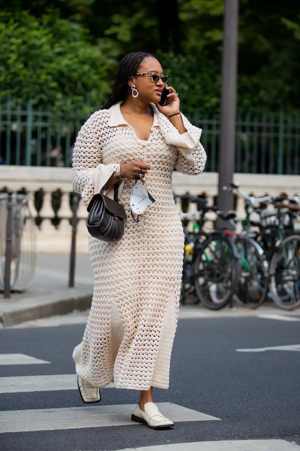 paris, france june 22 a guest is seen wearing creme white dress, black bag outside lemaire during paris fashion week menswear springsummer 2023 on june 22, 2022 in paris, france photo by christian vieriggetty images