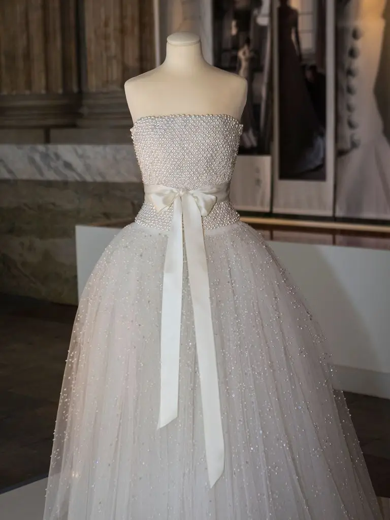 white strapless dress with bow on display