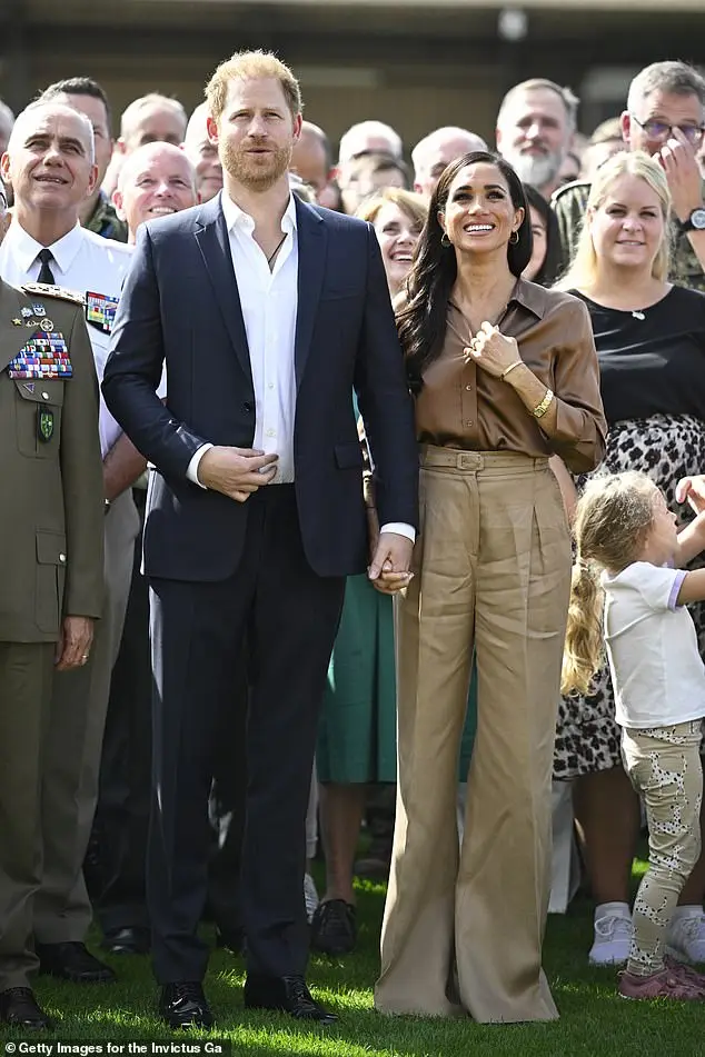 Pictured: Meghan Markle wore another pair of floor-length trousers for the Invictus Games in Germany in September 2023