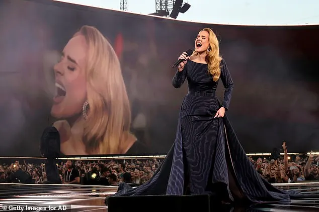 Addressing the crowd she said: 'Sadly I have to take this gorgeous train off because it is wet and heavy'