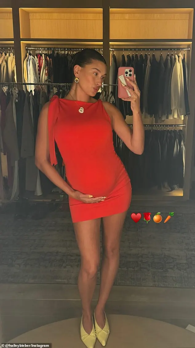 Hailey Bieber gave fans another look at her growing baby bump on Friday before stepping out for the night in Los Angeles