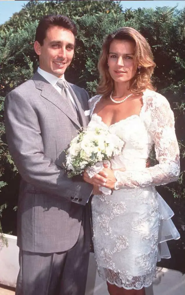 Princess Stephanie in a lacy white mini dress with her husband