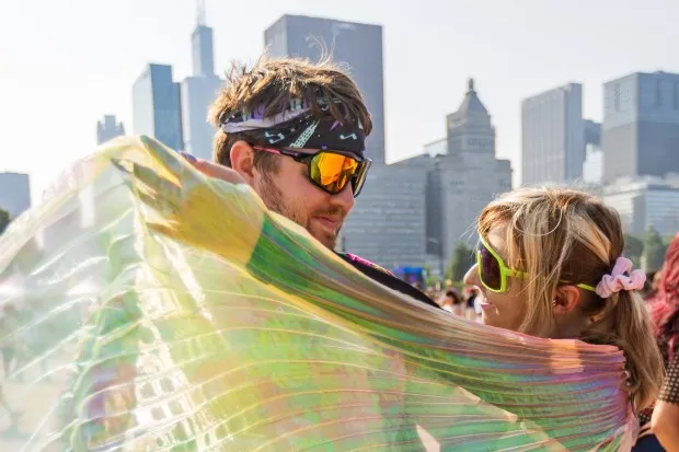 Isaac Langreck, 30, and Cassie Langreck, 28, from Wisconsin, pose at Lollapalooza in Chicago's Grant Park on Aug. 2, 2024. (Tess Crowley/Chicago Tribune)