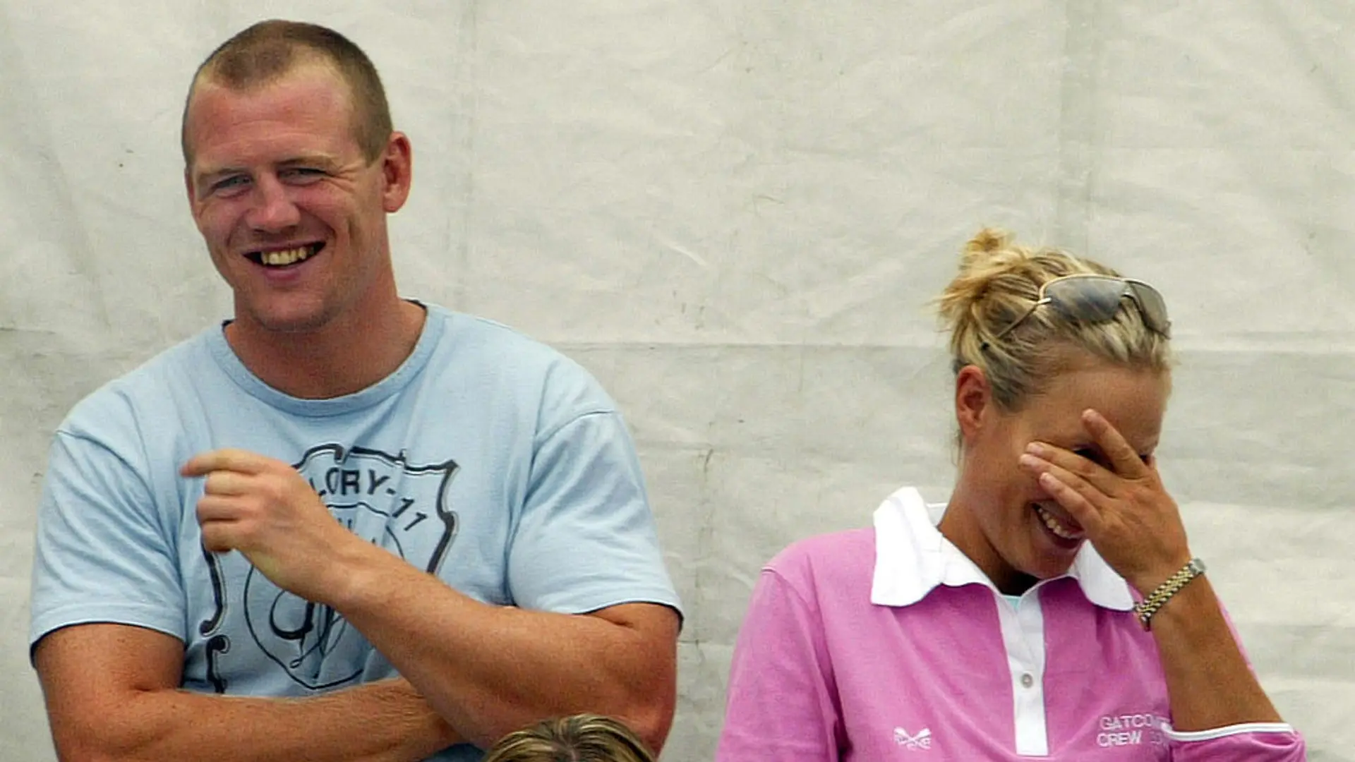 Mike and Zara Tindall laughing together.