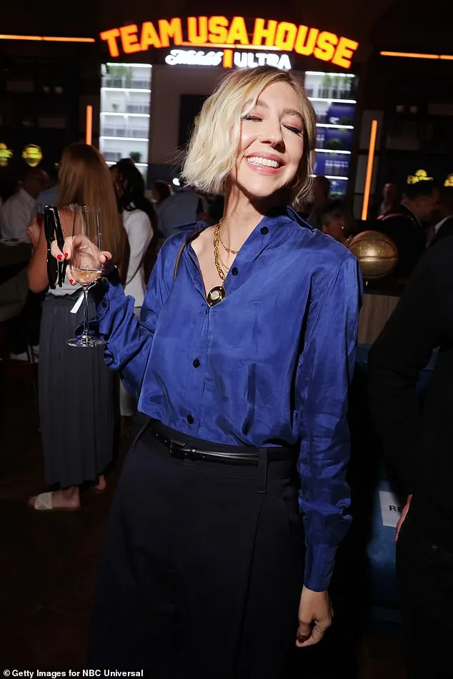 Saturday Night Live star Heidi Gardner, 41, looked chic in a navy silk top and skirt while enjoying a drink inside