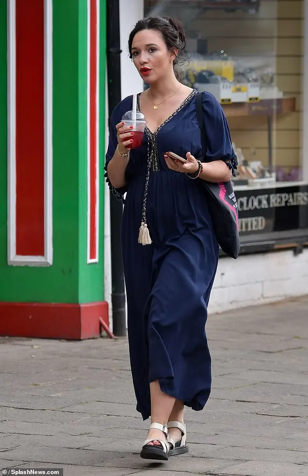 Charlotte Chilton, 33, continued to show off her chic maternity wardrobe in a stylish blue kaftan dress as she headed to a florist in Warwickshire on Monday