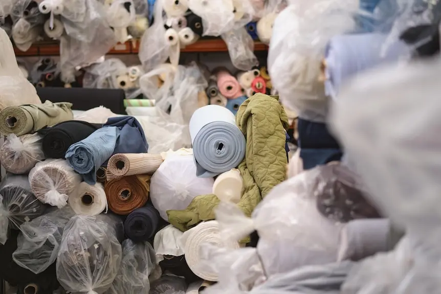 Rolls of fabric in a warehouse.