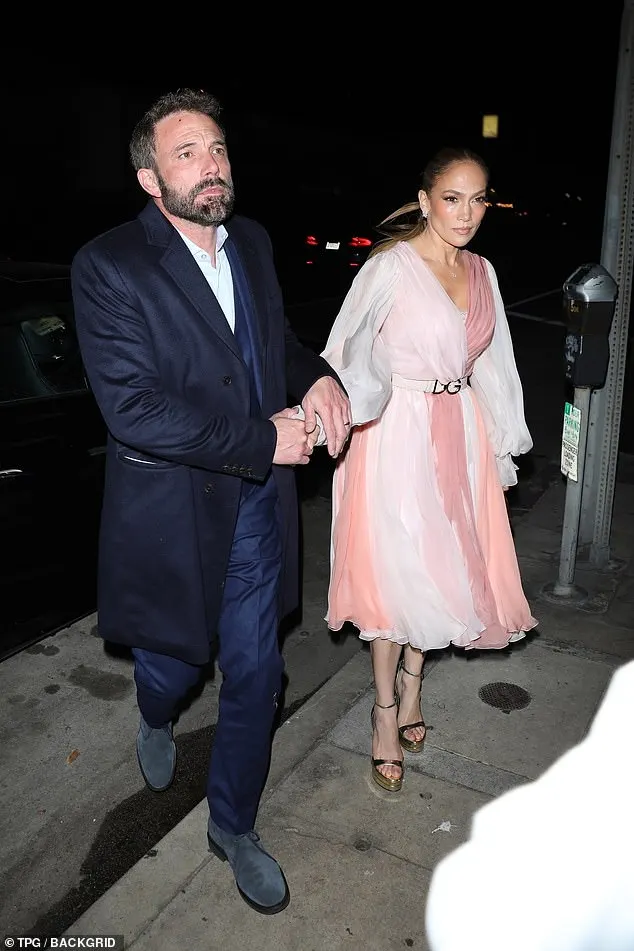 Lopez had previously elevated the frilly frock with a Dolce & Gabbana belt and sparkling diamond stud earrings during her romantic Beverly Hills dinner with Ben in February of last year — months before rumors of marriage troubles began to surface; (Affleck and Lopez in February 2023)