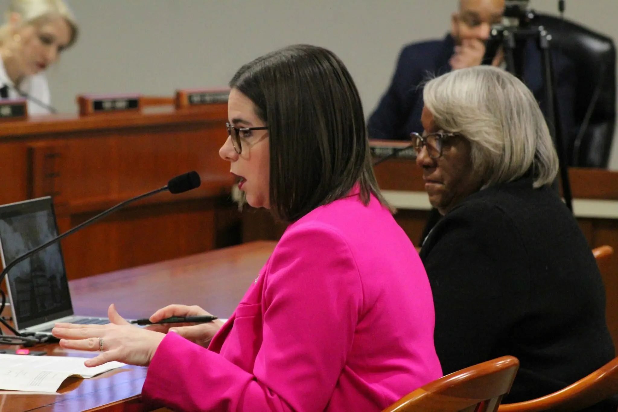 At a meeting of the Michigan State House Judiciary Committee on February 7, 2024, Rep. Laurie Pohutsky (D-Livonia ) ( left ) addresses the audience while Reps. Helena Scott (R-Daven ) and ( right ) listen. Anna Liz Nichols in a photograph