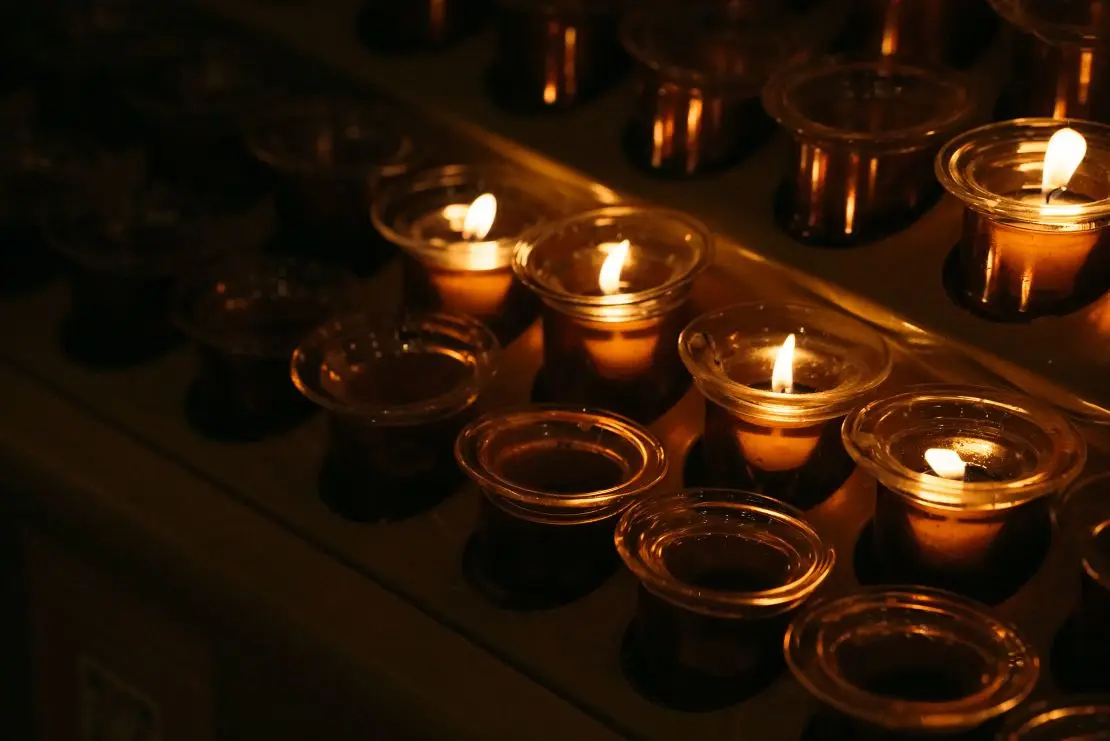 Mourners light candles inside St. Patrick's Cathedral before Gentili's funeral.