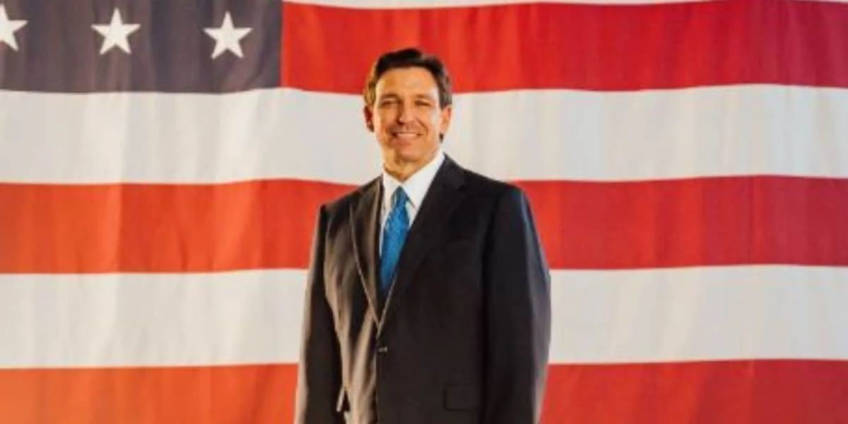 Florida Governor Ron DeSantis in front of an American flag