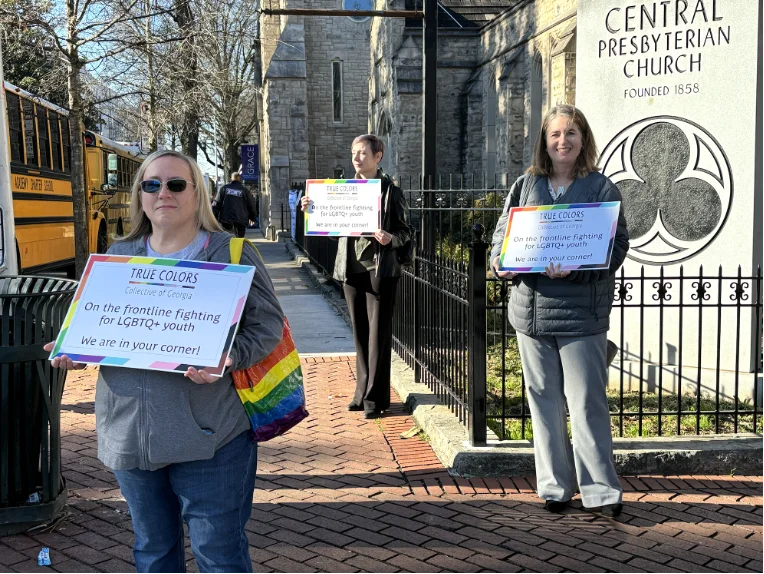 Members of the True Colors Collective of Georgia peacefully protest across the street from the Georgia State Capitol during the annual Legislative Prayer Breakfast on February 6, 2024.