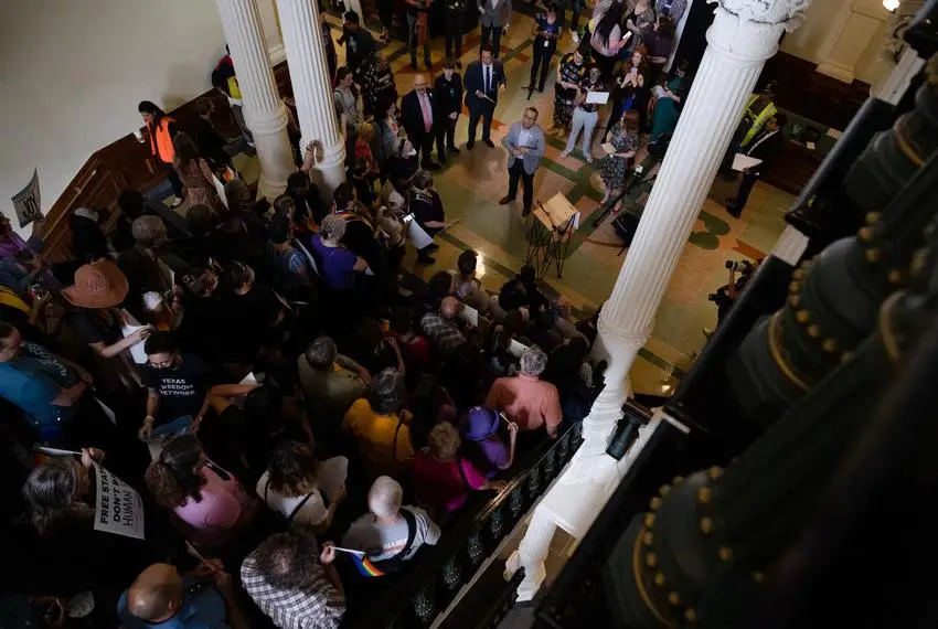 Ricardo Martinez, CEO of Equality Texas, prepares for a press conference in front of people who have gathered on the stairs across from the House floor to protest against SB 14, before it is heard for debate on May 12, 2023.