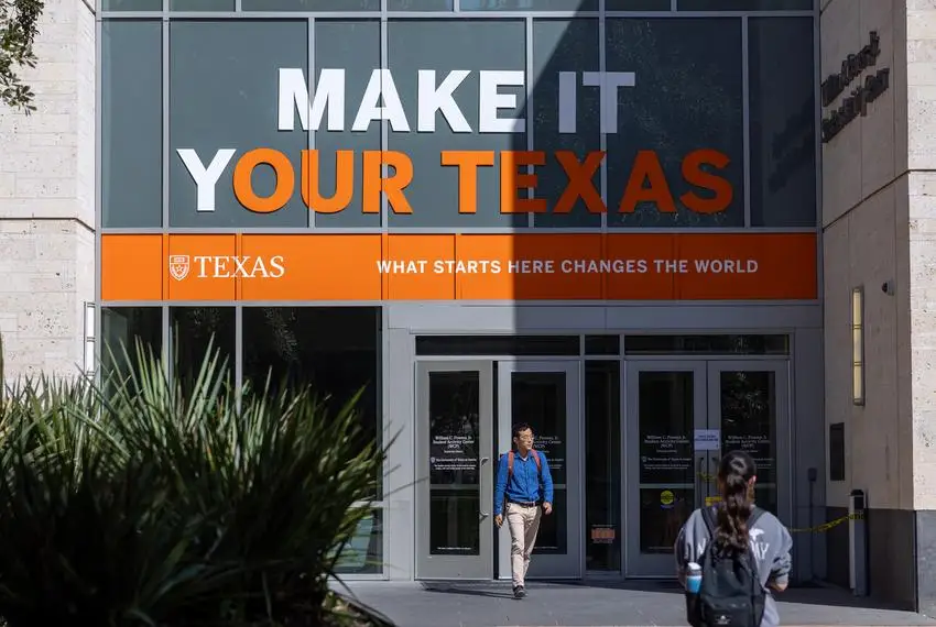 Students walk in and out of the William C. Powers Student Activity Center at the University of Texas at Austin on Feb. 22, 2024. A sign saying 'Make it Your Texas' is on the windows above the entrance.