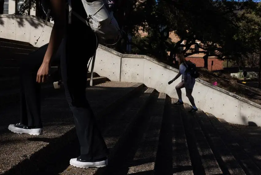 Student walk up the steps from Speedway towards the UT Tower at the University of Texas at Austin on Feb. 22, 2024.