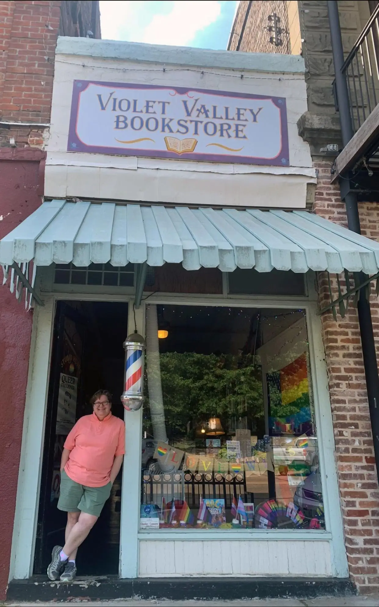 Jaime Harker, founder and owner of Violet Valley Bookstore stands outside the Water Valley, Miss. store Saturday, June 24, 2023. According to Harder, laws that restrict who transgender people can room with in colleges or prisons have the effect of potentially putting them in danger.