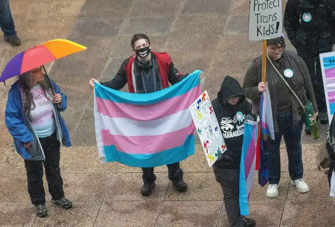 Protesters gather in front of the Ohio Statehouse on Jan. 24 as the Ohio Senate votes to override Gov. Mike DeWine's veto of House Bill 68.