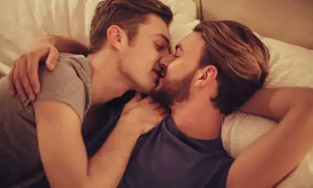 Young gay couple in bedroom