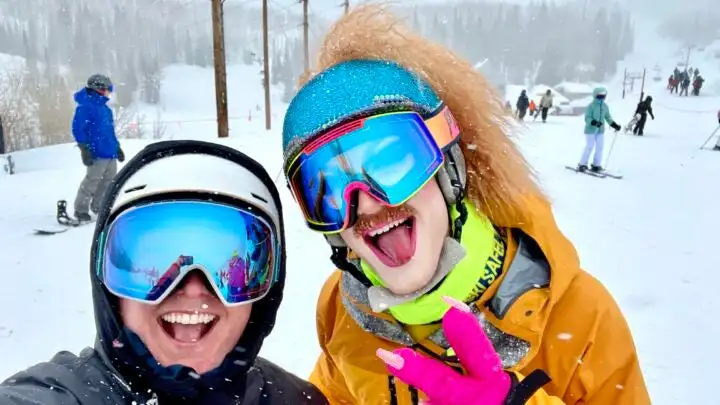 Writer Erica Zazo (she/they) takes a selfie with drag queen, Pattie Gonia.