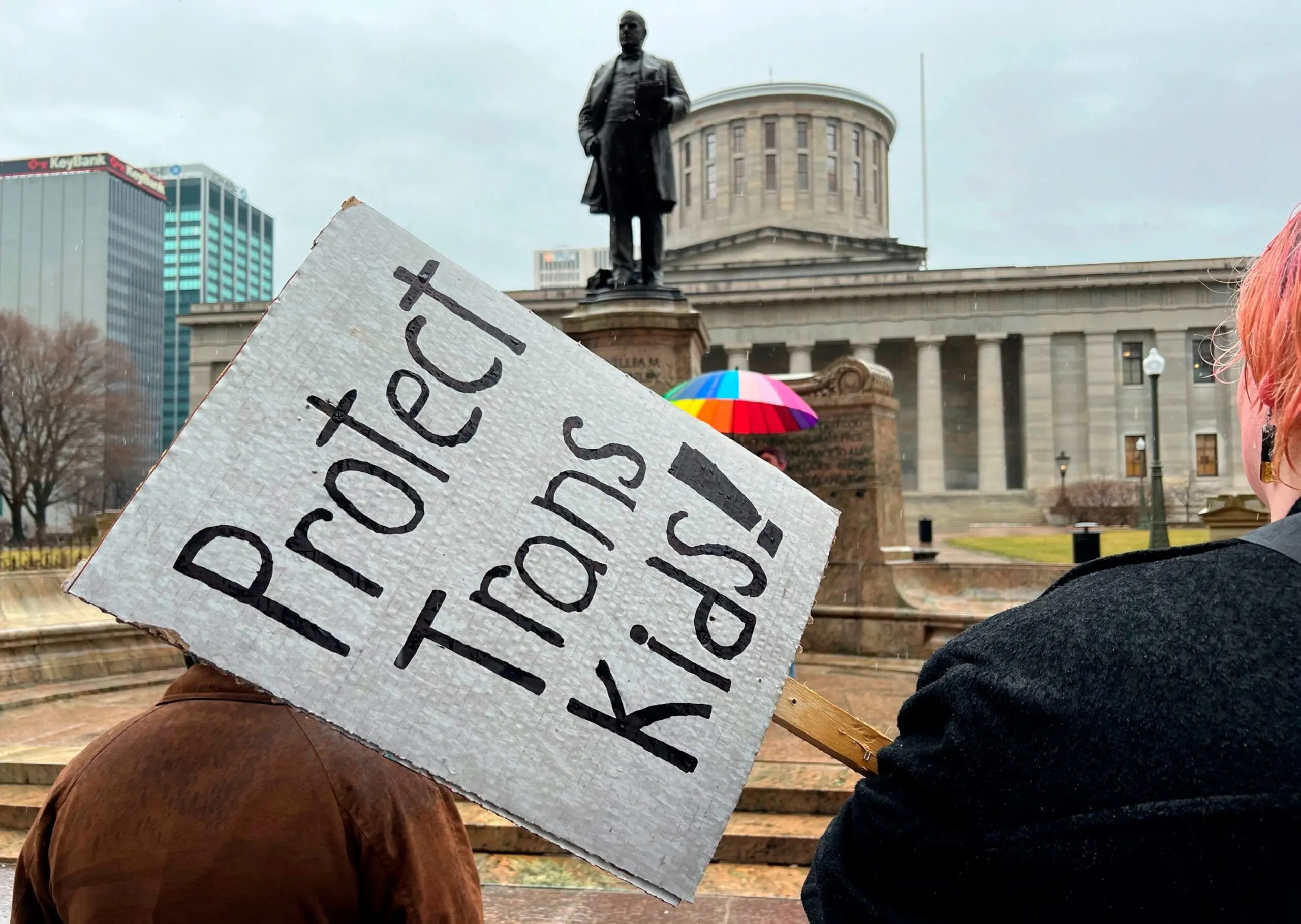 PHOTO: Protesters advocating for transgender rights and healthcare stand outside of the Ohio Statehouse, on Jan. 24, 2024, in Columbus, Ohio.